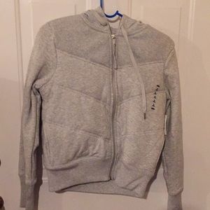 Grey insulated vest with sleeves